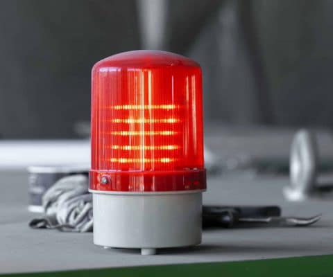 Warning light alarm in industrial plant close up